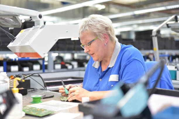 istock friendly woman working in a microelectronics manufacturing factory - component assembly and soldering 1374872326