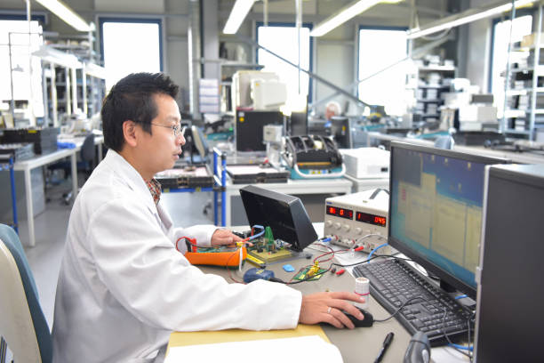 istock engineer at the workplace - assembly and development of electronics in a modern factory 1374873988