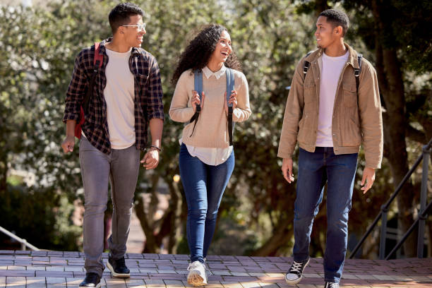istock Shot of a group of students walking through campus together 1374875792