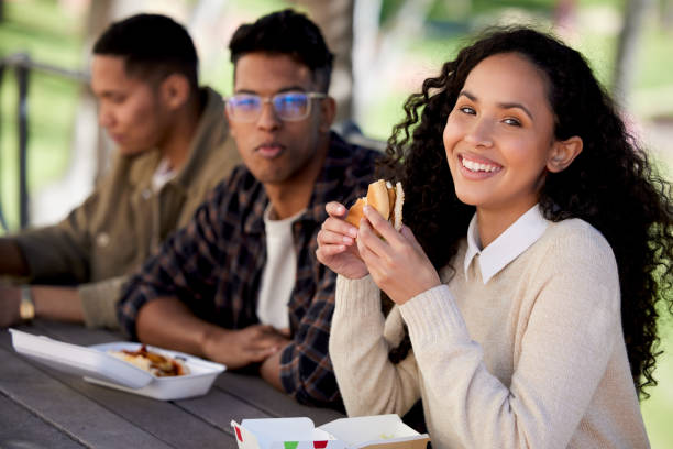 istock Shot of a group of students having a quick bite while studying together 1374876053