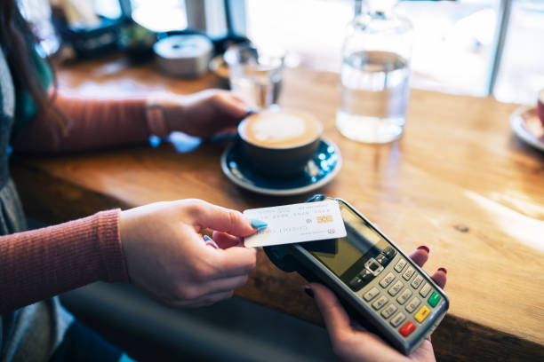 istock Woman making card payment. 1374876297