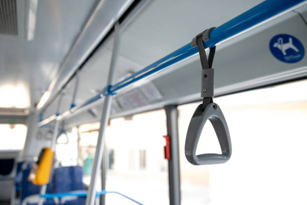 istock People Hand holding Handle on the train .Clipping path 1374876491