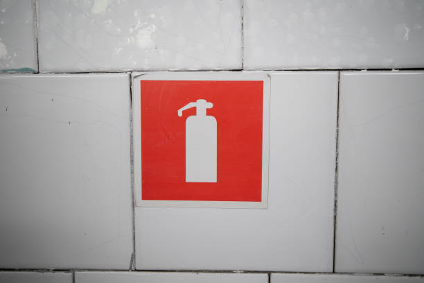istock Close up fire extinguisher sign in the building corridor. Selective focus image. Emergency sign. 1374881063