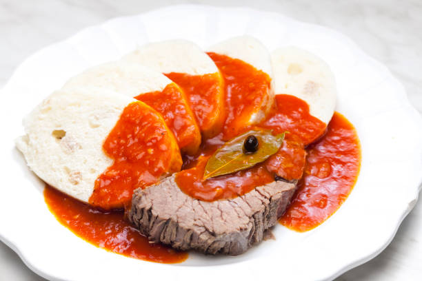 beef meat with tomato sauce and dumplings