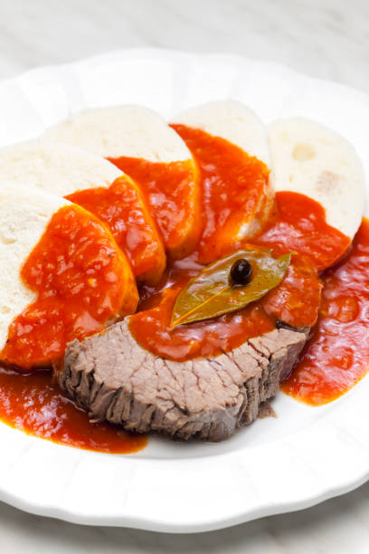 beef meat with tomato sauce and dumplings