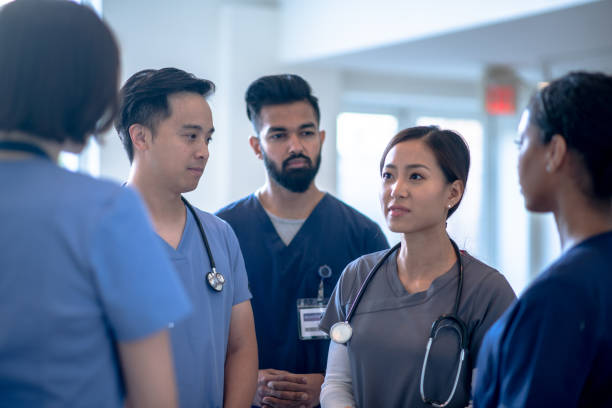 Casual Medical Team Standing Meeting stock photo
