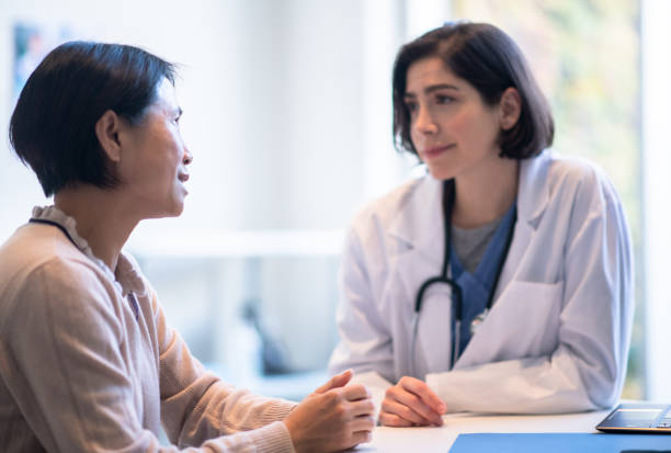 istock Senior Meeting with her Doctor 1374889388