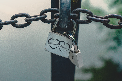 Makarska Croatia. Line of Love padlocks hanging on a chain. Love locks. Wedding locks. Symbol of eternal love. Valentine day. Colorful padlocks. Loyalty. Greeting card