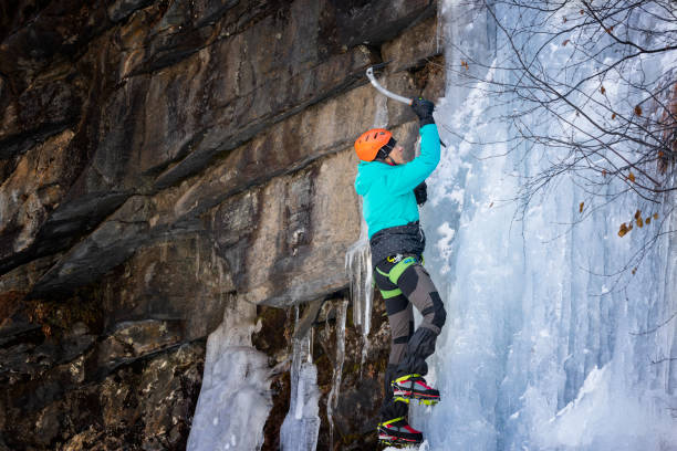 istock Young Woman Ice Climbing 1374903124