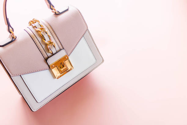 istock Luxury pink tone handbag on a light pink background. 1374914026