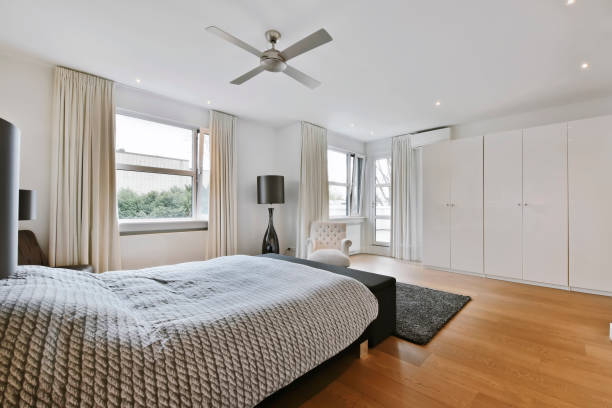Bedroom in a minimalist style with two windows