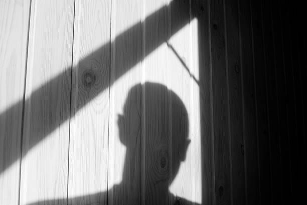 Burglary Shadow of burglar (or murderer or rapist) just before he makes his entrance through an open window. sexual assault stock pictures, royalty-free photos & images