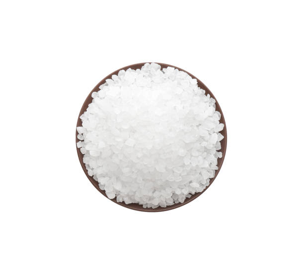 istock Bowl with natural salt isolated on white, top view 1374930044