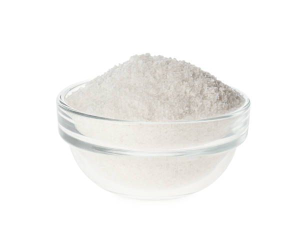 istock Glass bowl with natural salt isolated on white 1374934786