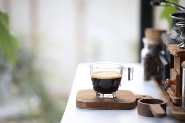 istock Espresso glass cup on wooden tray 1374964527