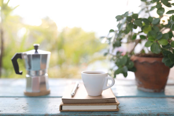 istock Small coffee cup and notebook and plant pot 1374964530