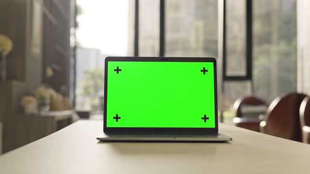 Dolly shot of computer laptop with green screen,No people