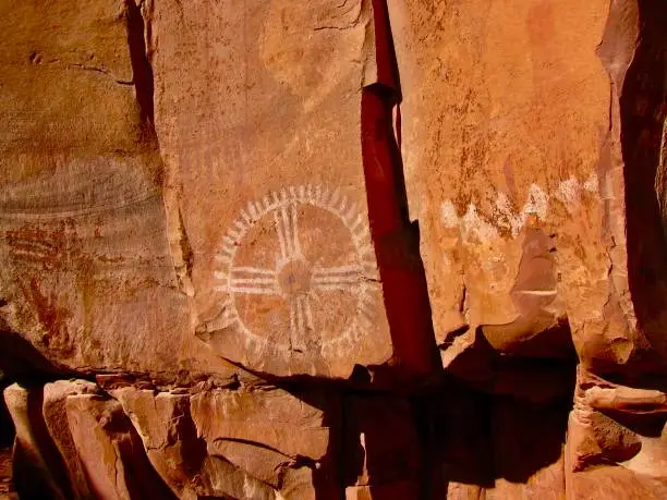 This red rock Sun pictograph was created by the Sinaguas during the Archaic period, estimated to be 6,000 years old. The Palatki Heritage Site is located in the Coconino National Forest, near Sedona, Arizona.