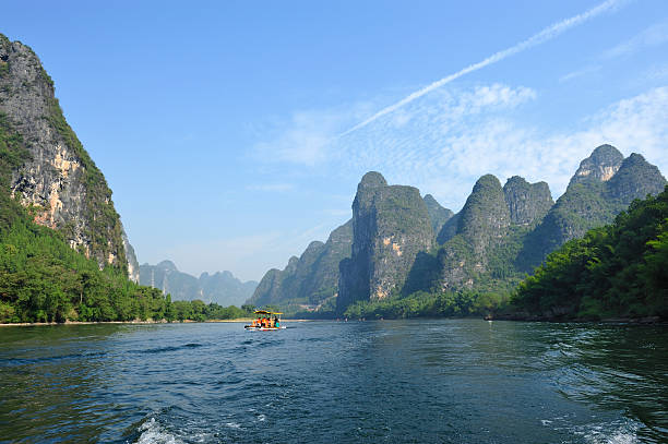 istock hills,river and sightseeing boat 137498485