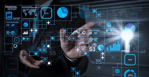 Financial report data of business operations (balance sheet and income statement and diagram) as Fintech concept.businessman hand working with touch screen in action