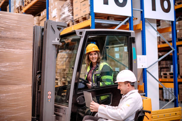 People with disabilities working in pallet warehouse stock photo