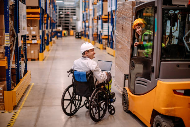 People with disabilities working in pallet warehouse stock photo