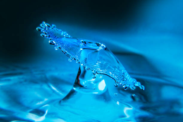 istock Colliding water drops shaping a water umbrella 1375008847