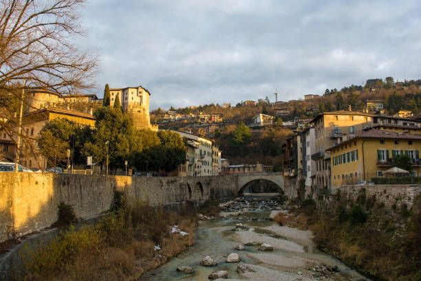 Torrente Leno river as it flows through Rovereto in Trentino, NE Italy. It is one of the main tributaries of the Adige river. Ponte Forbato bridge is centre