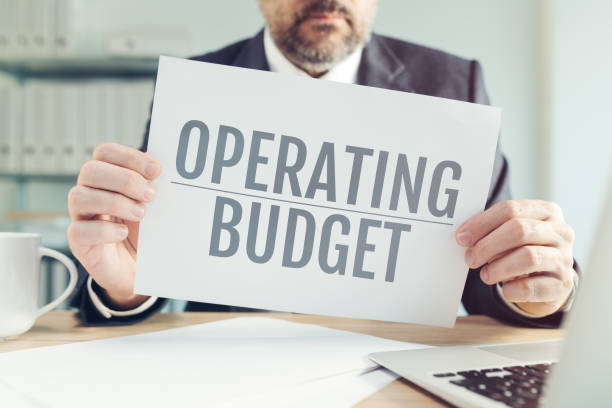 istock Operating budget concept, business manager holding paper with text 1375013112