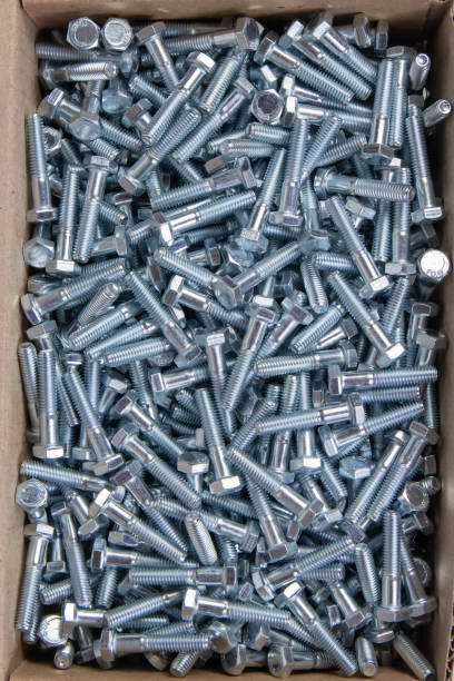istock metal bolts in a cardboard box. view from above 1375015883