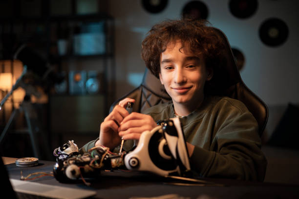 istock A young boy passionate about electronics, gifted with manual skills, twists his own robot model, tightens screws, builds a toy for a school project 1375016434