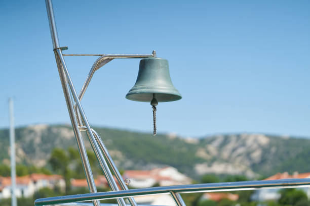Ship bell of a sailing yacht in the harbor of Rab in Croatia stock photo