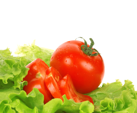 Green salad and tomato isolated on the white background