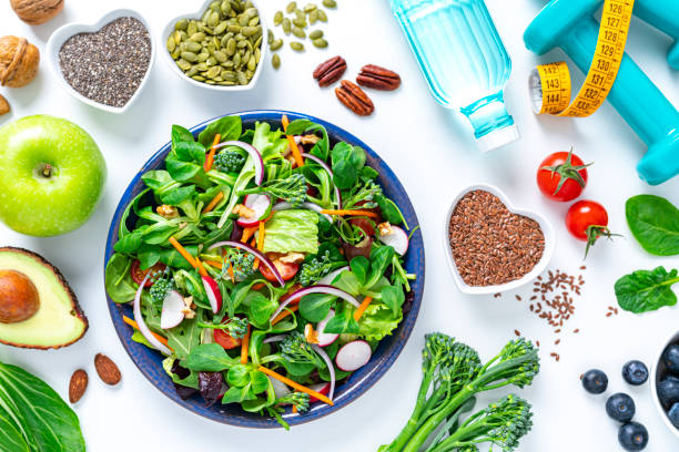 istock Healthy fresh vegetables salad plate on white background 1375039625