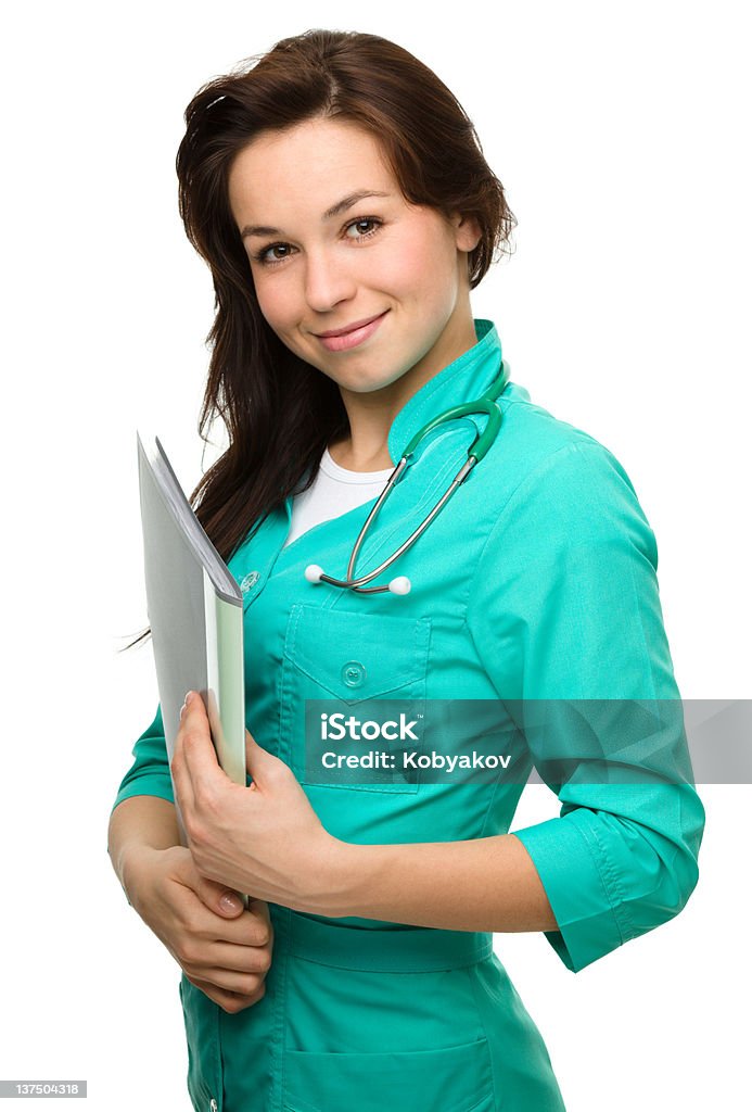 Jovem atraente mulher vestindo um uniforme de Médico - Foto de stock de Adulto royalty-free