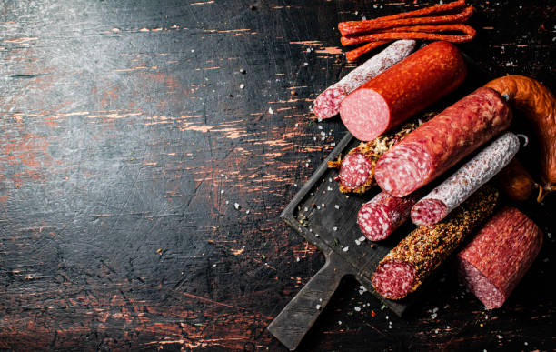 istock Different types of salami sausage on a cutting board. 1375062812