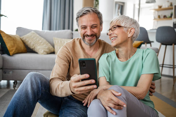 istock Cheerful man taking selfie with his wife 1375063150