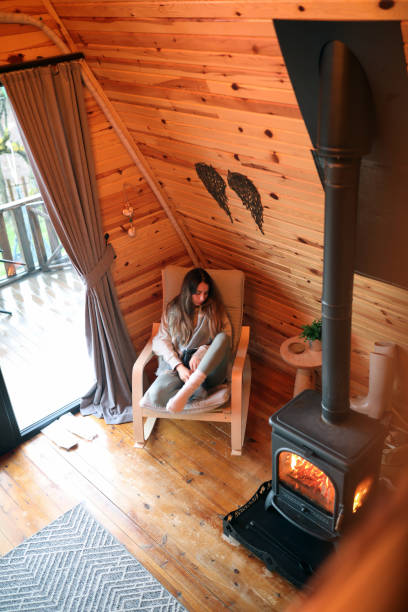 istock Tired Young Woman Sleeping By The Fireplace 1375068703