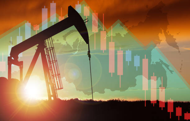 Sunset Over Pumpjack Silhouette With Stock Chart and Russia Map Background Pump jack silhouette against a sunset sky with Russian map and declining stock chart background. Concept of depletion or declining oil production and gas industry or falling oil prices in Russia. opec stock pictures, royalty-free photos & images