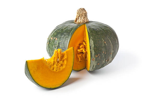 istock Sliced of green pumpkin with orange pulp inside 137508971