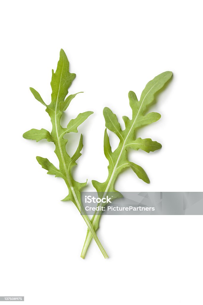 Due fresco verde foglie e rucola su sfondo bianco - Foto stock royalty-free di Cibo