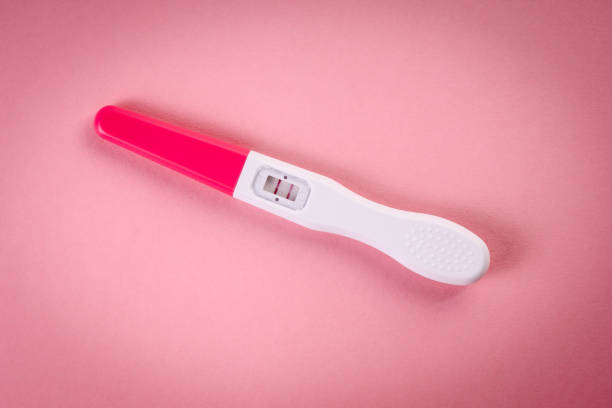 istock Positive pregnancy test on a pink background. New life concept 1375092019