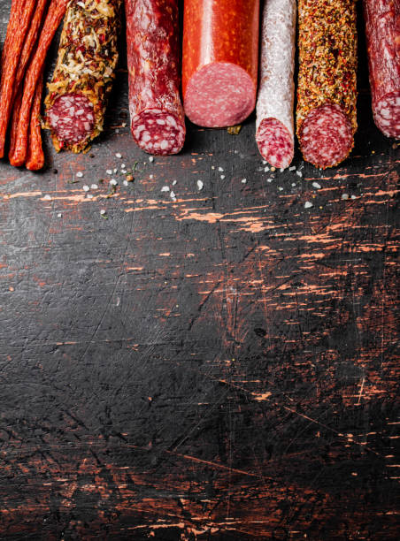 istock Various salami sausage on the table in a row. 1375113090