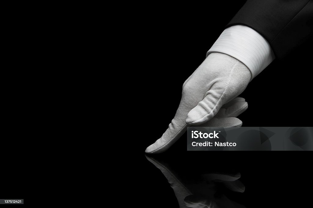 Quality control Human finger checking the quality Glove Stock Photo