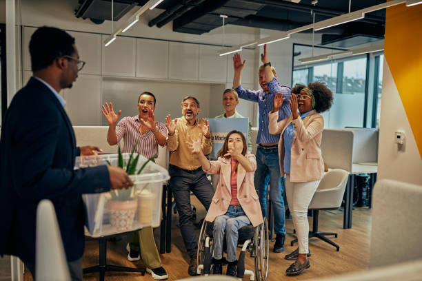 istock Colleagues rejoice because their coworker return to work 1375132282