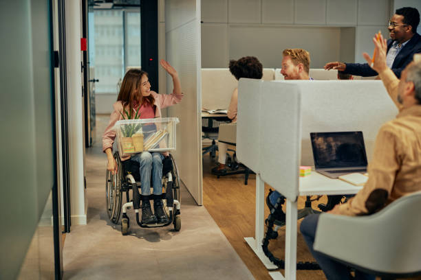 istock Coworkers greets their black colleague who return to work 1375134914