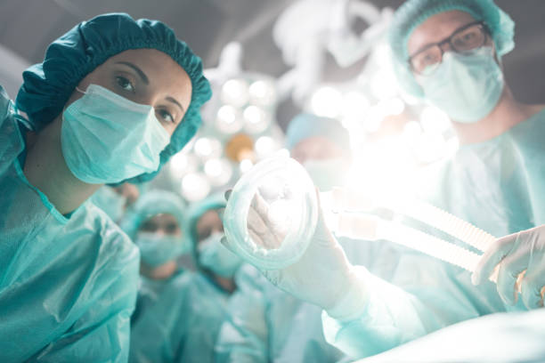 Medical team performing surgical operation stock photo