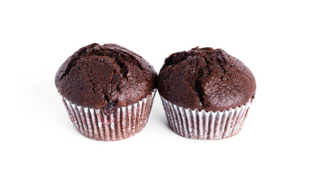 istock Chocolate cupcakes with cherry jam isolated on a white background. Chocolate muffin 1375154367