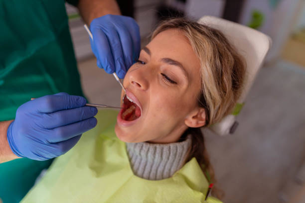 istock Female patient having monthly control at dentist 1375154389