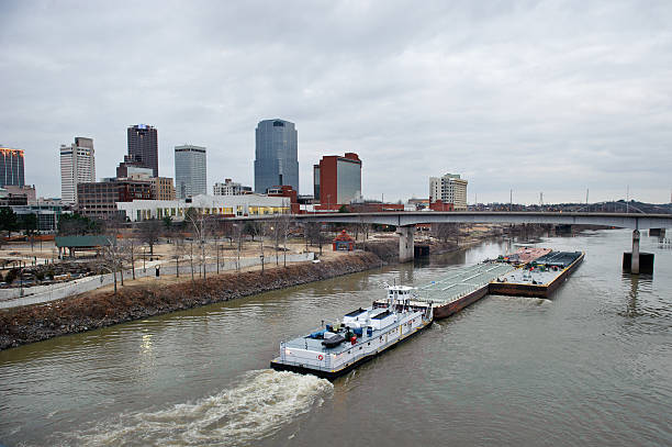 istock Tugboat passes through city at sunrise 137516763